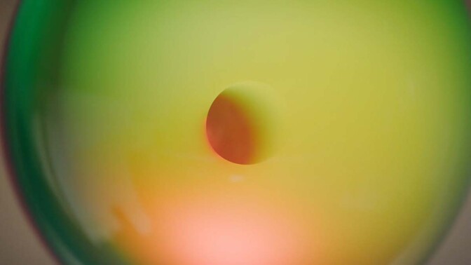 A detailed shot of a multi-colored sphere by Helen Pashgian. | Still from Artbound "Light & Space" ab s11