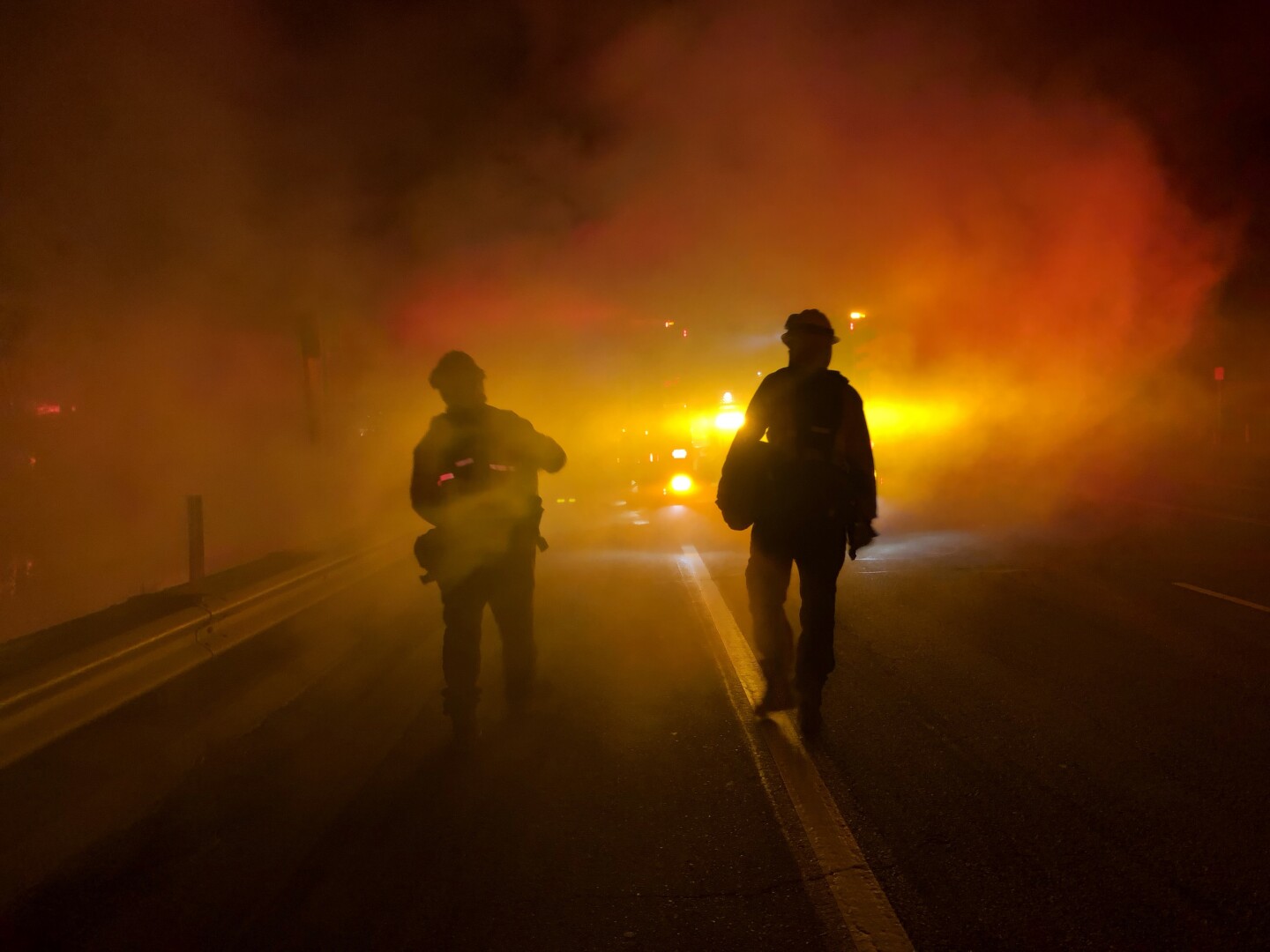 Members of Los Angeles County Fire personnel along PCH at Paradise Cove, early morning of November 10.