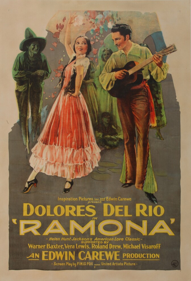 A 1928 movie poster advertises the film, "Ramona" which is written across the bottom of the poster. Just above the film title reads "Dolores del Rio," the star of the film. The dominant imagery is a woman in a frilled pink skirt with her toe pointed, a hand on her waist, and her other hand delicately in the air. She looks over her shoulder at a man playing a guitar, gazing at her.