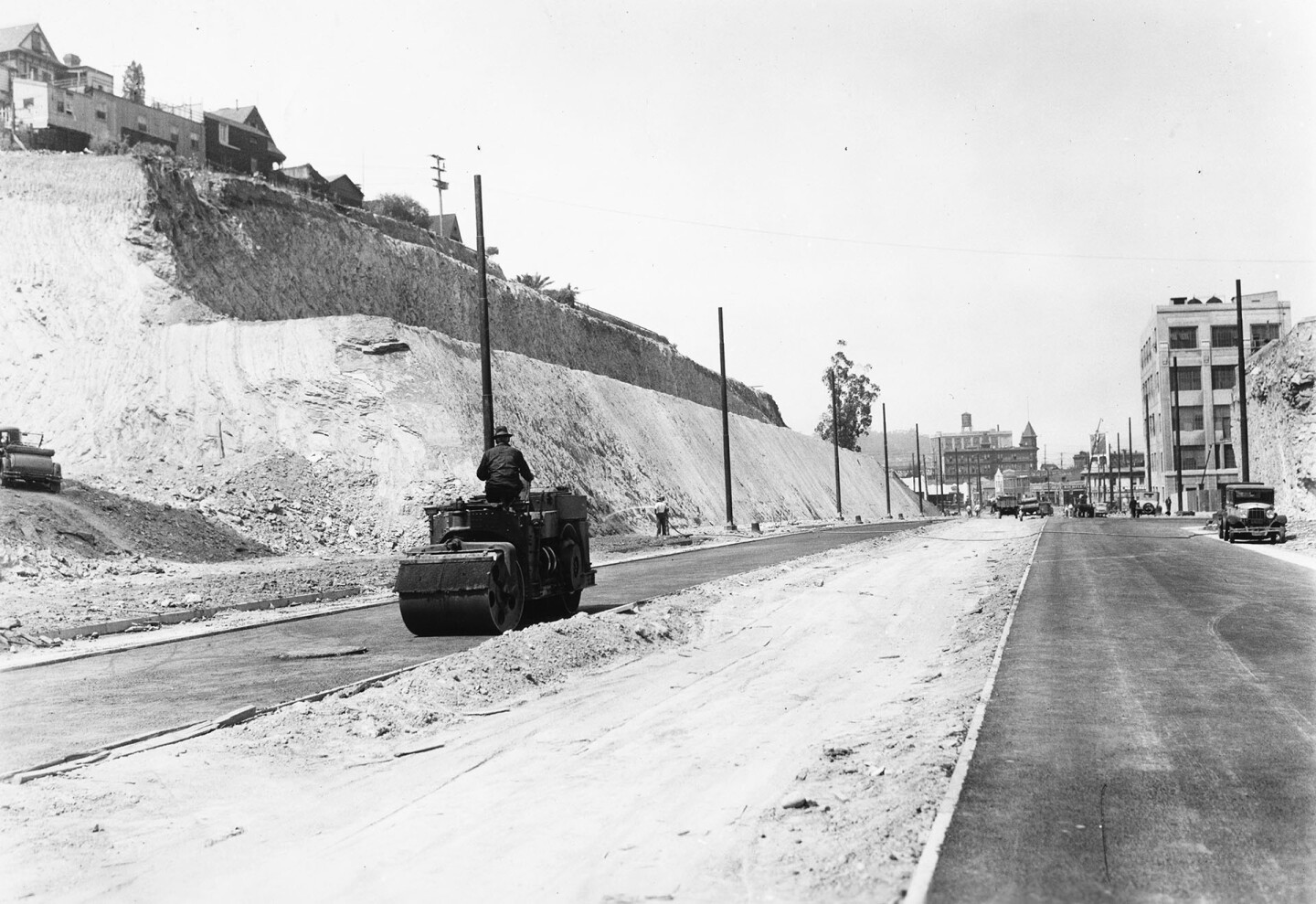 Workers trimmed back Fort Moore Hill to extend Spring Street, shown here circa 1935, northward. Courtesy of the USC Libraries - California Historical Society Collection.