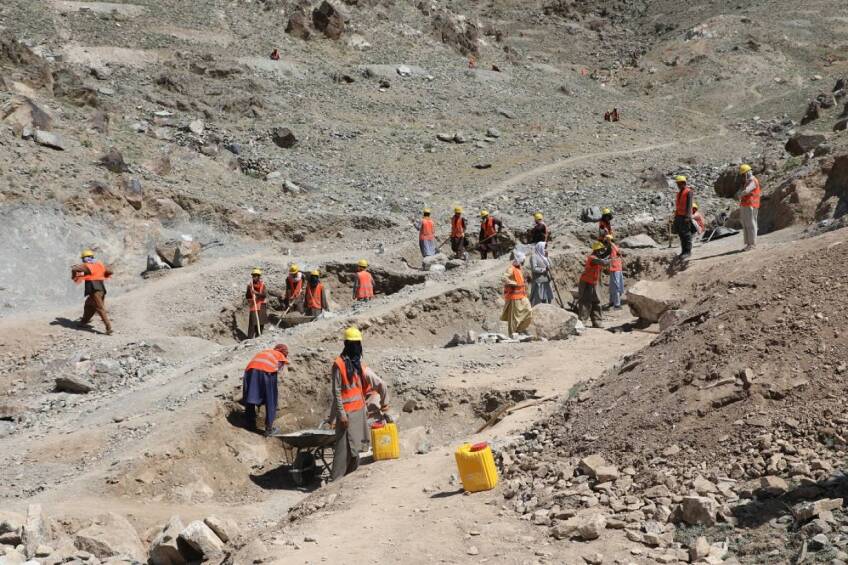 Labourers on the hills of Bagrami, on the outskirts of Kabul, dig trenches to help improve the city's water supply, Kabul, Afghanistan, June 6, 2020. | Thomson Reuters Foundation/Shadi Khan Saif