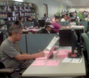Vote by Mail ballots going through signature verification and cross-checking with precinct rosters. | Photo: Courtesy RR/CC