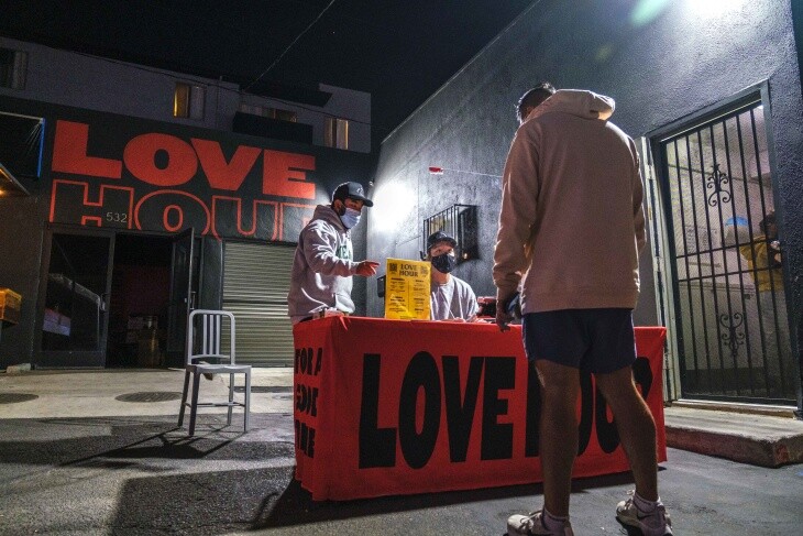 A customer orders at Love Hour's parking lot pop-up. | Chava Sanchez/LAist
