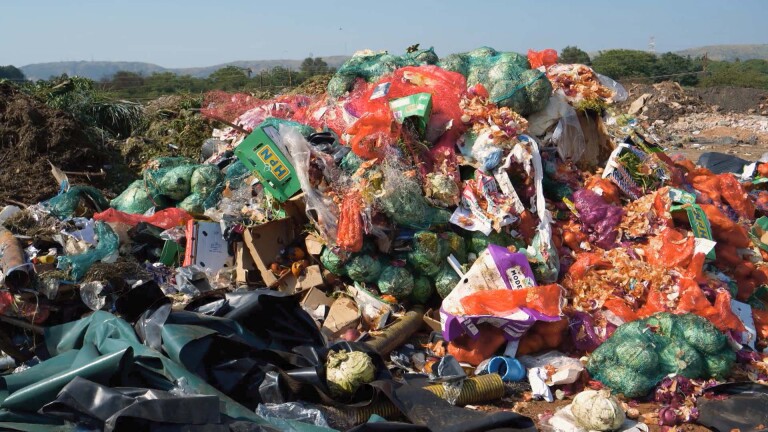A mountain of food waste in a landfill. | Still from "Broken Bread"