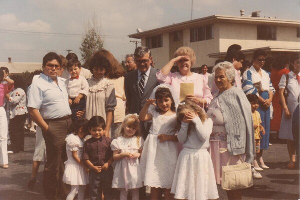 First Holy Communion, 1988. My aunt and uncle and their 3 kids are on the left, my sisters are by me, my grandparents are behind me, and to the far right is my great grandmother | Courtesy of Toni Plummer