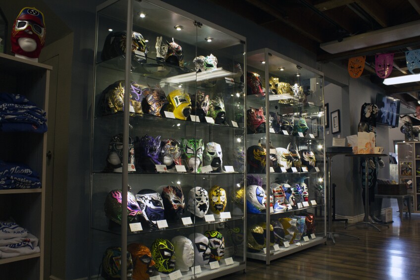 A display case of lucha libre masks at Republic of Lucha in South Pasadena.