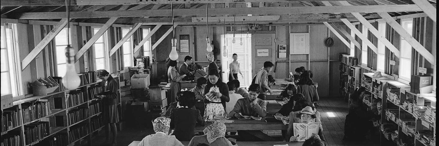 San Bruno, California. A barrack building at this assembly center has been reserved for the library which has just been established with a trained librarian of Japanese ancestry in charge.| US National Archives and Records Administration