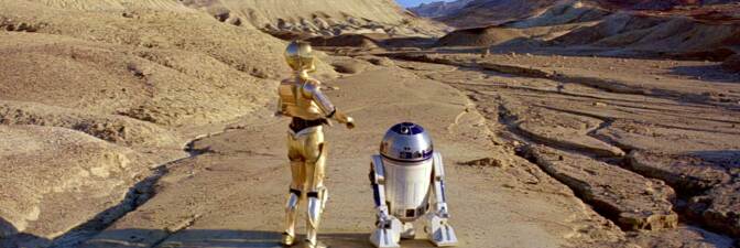 C-3PO and R2-D2 walk toward Jabba's Palace, which was filmed in Death Valley's Twenty Mule Team Canyon for this scene in “Episode VI: Return of the Jedi.” Lucasfilm, LTD.