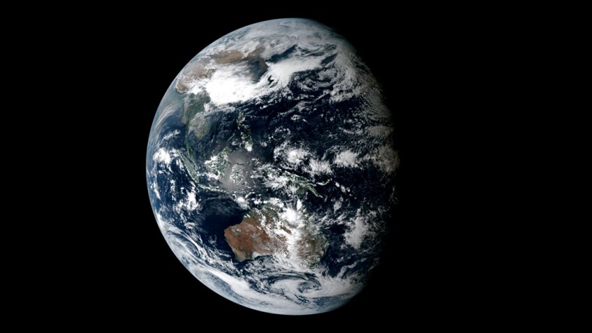 Earth with Solar Eclipse, 2016 Still image from projected video, 8ft diameter Marit Jentoft-Nilsen, Visualizer Courtesy of NOAA/Japan Meteorological Agency (JMA), DSCOVR/EPIC images, NASA/Goddard