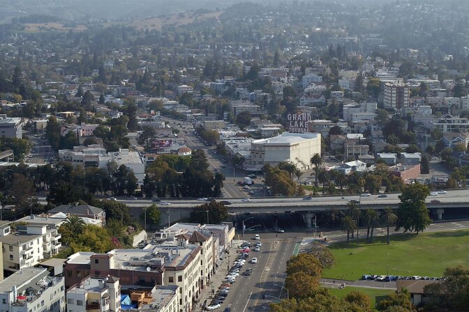 Oakland drone shot over Grand Lake Theatre and Eastshore Park. | Still from "City Rising: The Informal Economy"
