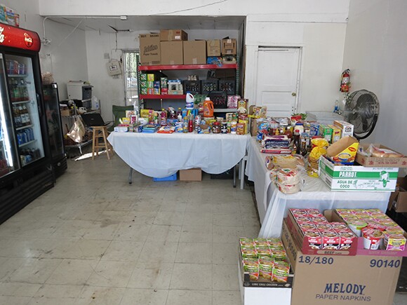 Pre-transformation: products sat on tables rather than organized on shelves in Sociedad Market.<br />